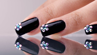 Woman hand black nail polish - iridescent accent free wallpaper