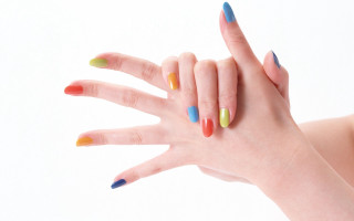 Woman hand multicolored nails ring - a pastel free wallpaper
