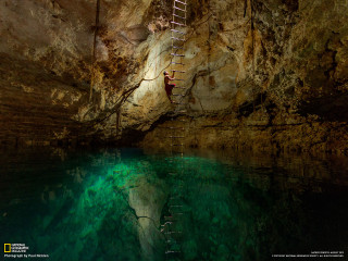 Man climbing ladder cave water - a cave painting free wallpaper