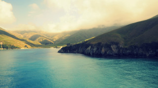 Water mountains clouds boat scenery - the water below free wallpaper