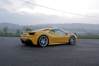 Yellow sports car parking lot 30 - a foggy sky free wallpaper