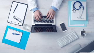 Person typing laptop medical office - a stethoscope free wallpaper