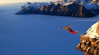 Man jumping cliff water snowboard 2 - extreme free wallpaper