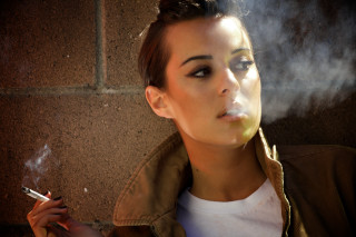 Woman smoking cigarette brick wall 2 - a woman smoking free wallpaper