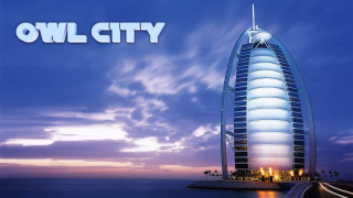 Tall building water beach sky - free city wallpaper