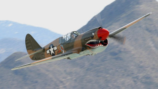Fighter plane shark mouth flying - photorealistic imagery free wallpaper