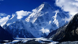Snowy mountain blue sky clouds 11 - a river below free wallpaper