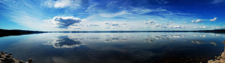 Lake clouds rocks shore scenery - free beach wallpaper for desktop