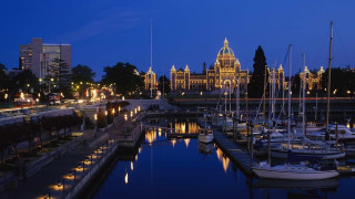 Harbor boats docked night clock - a clock tower in the background free wallpaper