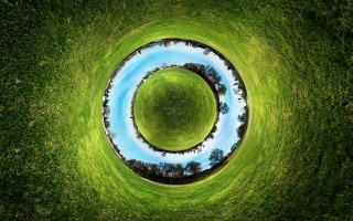 Circular grassy field blue pond - fisheye len free wallpaper
