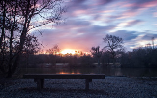 Bench gravel lake sunset setting - dave allsop free wallpaper