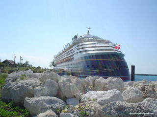 Cruise ship rocky shore blue - rock and grass free wallpaper