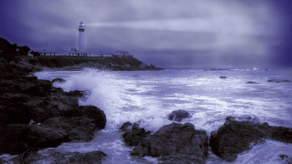 Lighthouse rocky shore wave crashing - a rocky shore free wallpaper for desktop