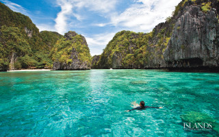 Swimming lagoon cliffs blue sky - a blue sky above them free wallpaper