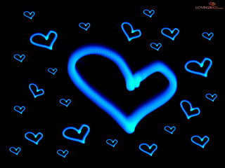 Blue heart surrounded black background - a blue heart free wallpaper