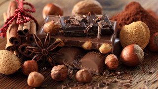 Chocolate nuts cinnamon wooden table 2 - a chocolate bar free wallpaper