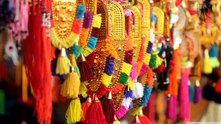 Colorful tassels hanging wall storefront - vibrant free wallpaper