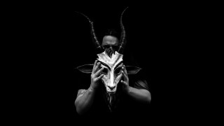 Man holding mask horned animal - a mask free wallpaper