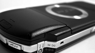 Cell phone table charger plugged - product photo free wallpaper