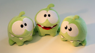 Green stuffed animals with eyes - product photo free wallpaper for desktop