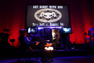 Man chair screen band guitar - a guitar in front free wallpaper