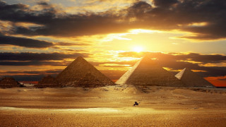Pyramids desert sunset person walking 2 - the desert free wallpaper for desktop