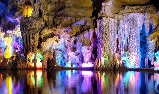 Cave waterfall group people colorful - a waterfall in the background free wallpaper for desktop