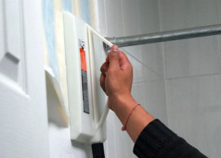 Person holding white object wall 2 - detail free wallpaper