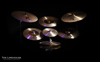 Cymbals black table person standing - studio photography free wallpaper