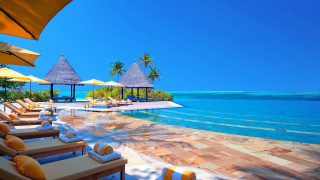 Resort pool lounge chairs umbrellas 2 - a resort free wallpaper