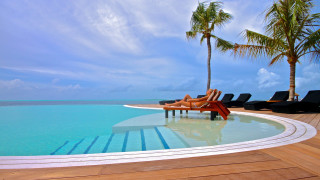 Woman lounging pool beach palm - chair free wallpaper