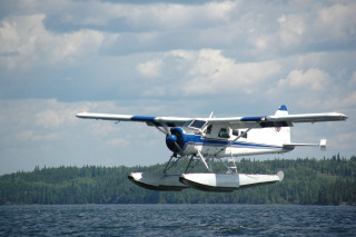 Small plane water trees cloudy - blue sky free wallpaper for desktop