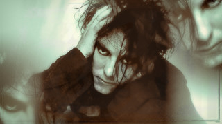 Man long hair serious head - his head in his hands free wallpaper