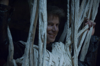 Smiling man holding rope structure - antipodean free wallpaper