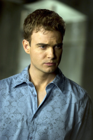Man blue shirt serious look 3 - his face and chest free wallpaper