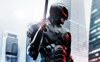 Futuristic man suit gun city 6 - a futuristic suit holding free wallpaper for desktop