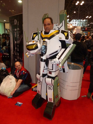 Man robot suit giant robot - people sitting free wallpaper