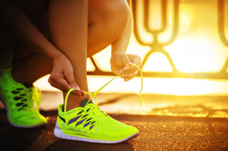 Woman tying shoelaces tennis shoe - a sidewalk free wallpaper for desktop