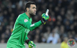 Man green uniform holding soccer - his hand and a ball free wallpaper