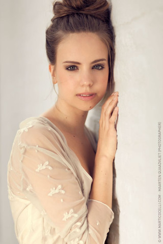 Woman bun hair leaning wall - eszter mattioni free wallpaper for mobile