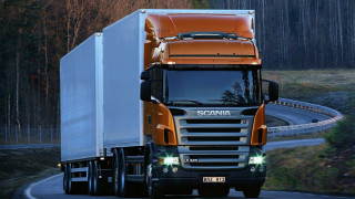 Truck driving road forest night - a forest in the background free wallpaper