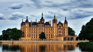 Large building towers water trees - free architecture wallpaper for desktop