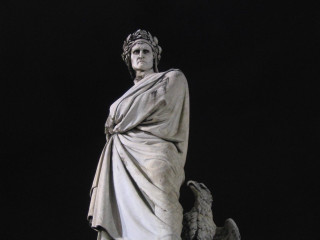 Statue woman bird shoulder black - a black background behind her free wallpaper