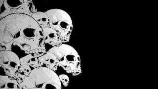 Skulls stacked black background white - a black background behind them free wallpaper