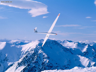 Glider flying snowy mountain range - zenith view free wallpaper