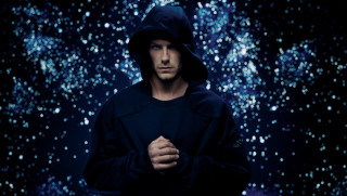 Man hooded jacket stars hologram - tech wear free wallpaper