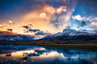 Mountain range lake cloudy sky 2 - a lake in the foreground free wallpaper