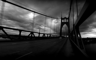 Black white bridge clouds street - the background and a street light in the foreground free wallpaper
