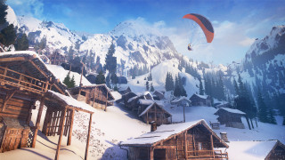 Mountain village parachute snow covered - a mountain range in the background free wallpaper