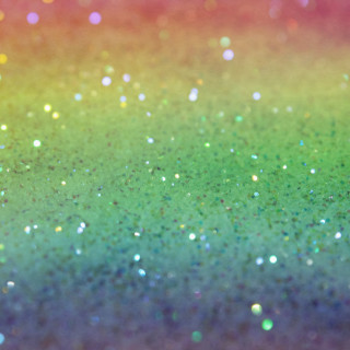 Multicolored glitter dots blurry background - free stars wallpaper for tablet